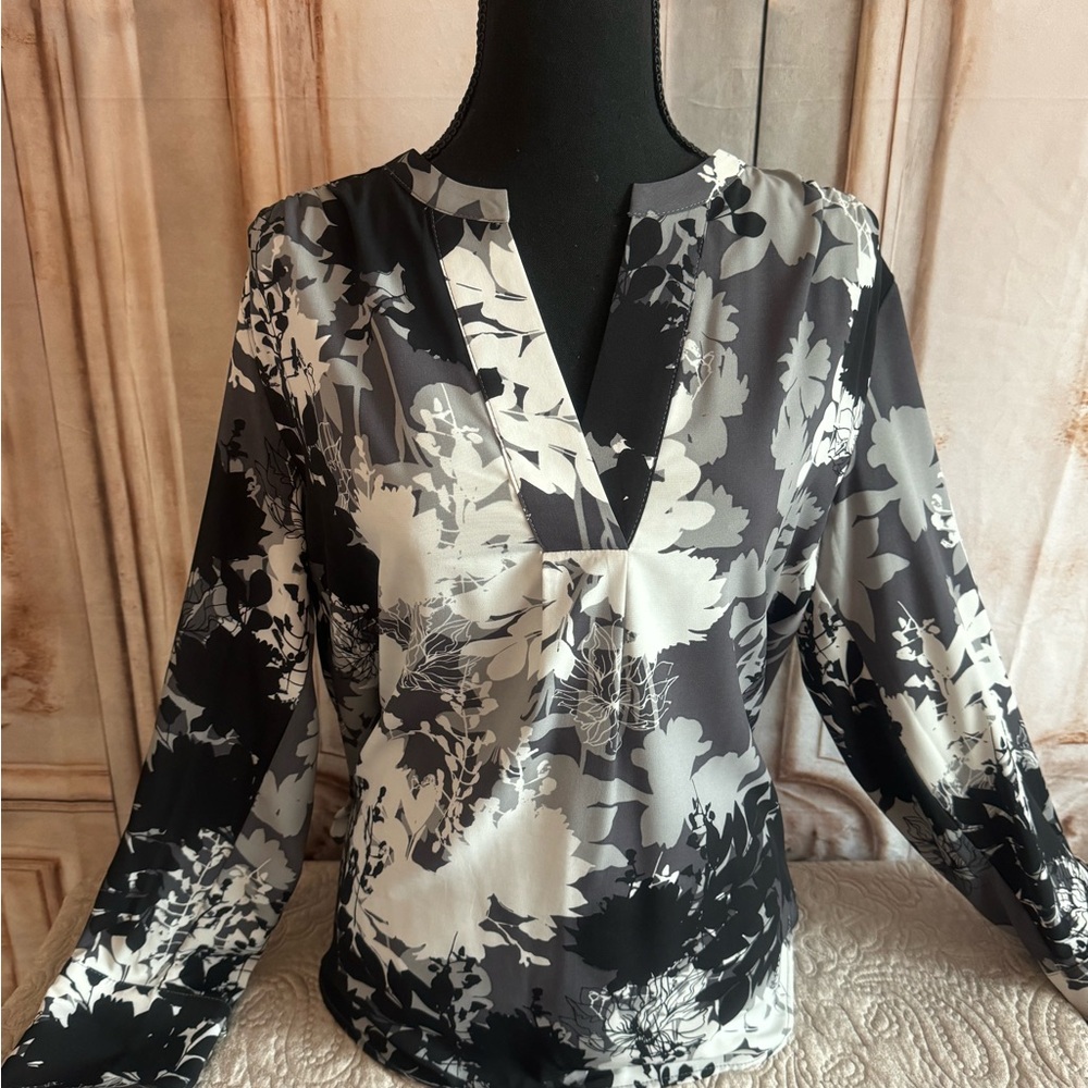 Calvin Klein black, dark and light gray floral pattern top.